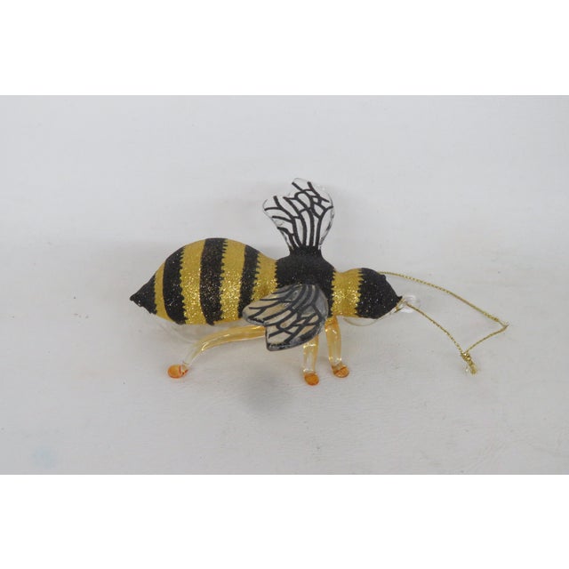 This charming Bumblebee Christmas Ornament is made out of blown glass. This adorable Ornament was designed and produced by...