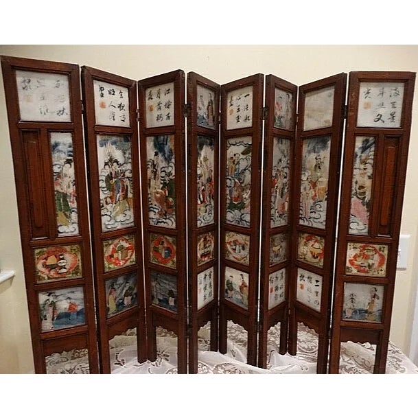 Beautiful 18th Century Chinese 8 panel hinged screen that is hand painted on both sides. The wood is dark and the inserts...