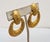 1960s "hammered" goldtone hoop clip earrings. Marked "PAULINE RADER." Measure: 1 7/8 inches long by 1 1/4 inches wide....
