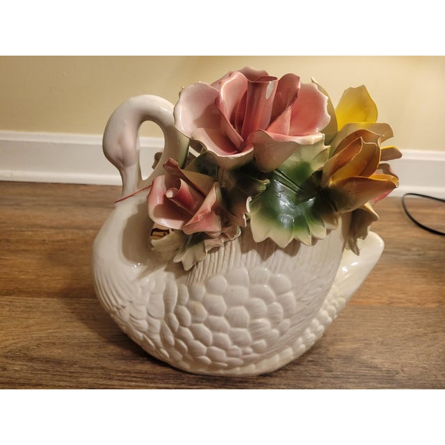 Beautiful vintage Italian Capodimonte porcelain swan floral centerpiece featuring an elegant white swan-shaped basket...