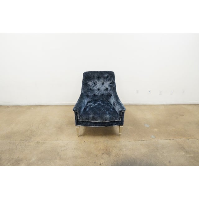 Traditional styling meets timeless sophistication in this beautifully crafted velvet accent chair. Upholstered in rich...