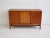 Sideboard made of teak wood with sliding doors and brass details. Manufactured and labeled by La Permanente Mobili Cantù....