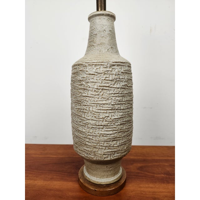 Beautiful pressed texture pottery lamp by Lee Rosen for Design Technics. This great mid-century lamp has a surface design...
