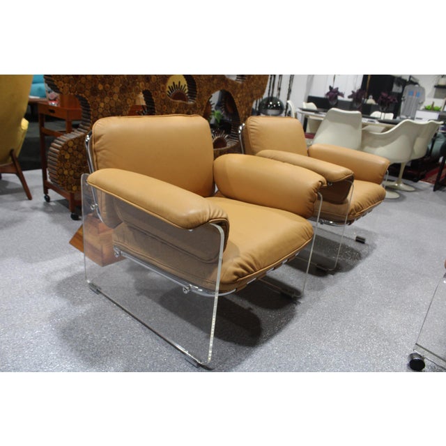These chairs have been reupholstered with down cushions wrapped in full grain Italian leather. Great vintage condition. No...