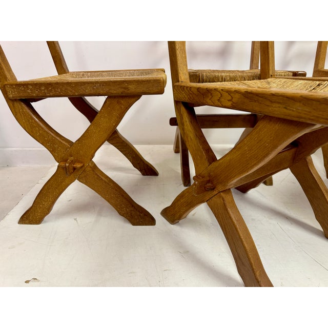 Set of six dining chairs Oak frames Rush seats One chair with damage to the seat (shown in the photos) Seat height 48cm...