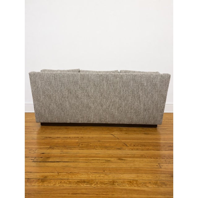 Beautiful transitional Kravet 3 seater sofa upholstered in a nubby boucle woven in shades of cream, charcoal & taupe.