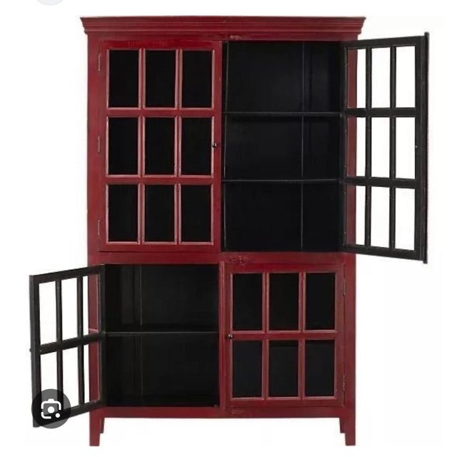Elegant Rojo cabinet from Crate & Barrel, crafted from solid sheesham wood with a rich, hand-finished surface and natural...