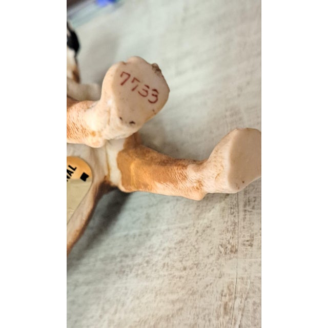 Biscut porcelain Boxer dog figurine created by the Italian firm Vaga Internacional, which existed between 1970 and 1980....