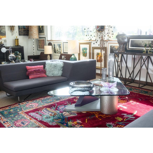 A vintage post modern memphis style coffee table. This is a super fun post modern coffee table with a mix of materials and...