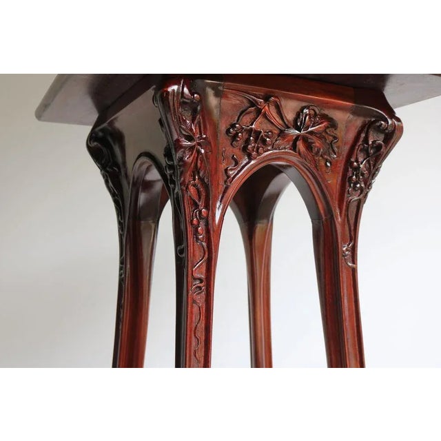 Exquisite pair of stylized Art Nouveau plant stands / pedestals by Louis Majorelle designed in 1907 with carved ''Vigne...