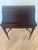Elegant and highly decorative, this vintage Bombay secretary desk features a distinctive tambour roll-top design that...