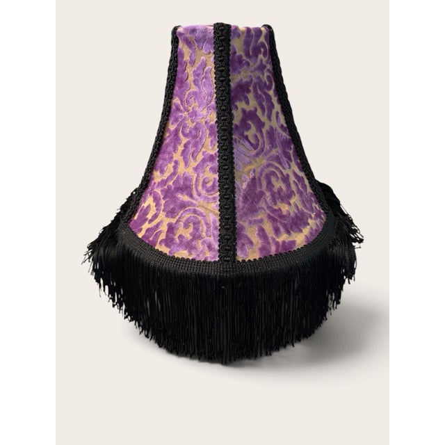 Make a dramatic statement with this stunning vintage-style lamp shade featuring luxurious purple velvet with an elegant...