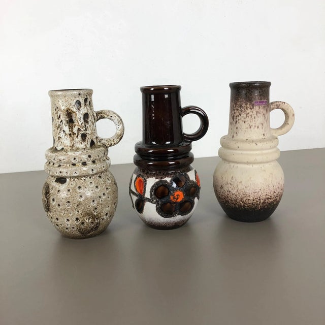 Set of three fat lava art vases Model: Vienna 428 26 Producer: Scheurich, Germany Decade: 1970s Description: These...