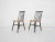 Spindle back chairs with black legs and black spindles.In the style of Ilmari Tapiovaara , Pastoe or Nesto. The chairs...
