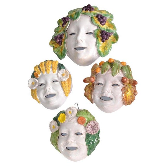 Set of 4 hand-painted and hand-crafted Majolica Masks, one of them is way bigger than others, Italy circa 1960. The pieces...