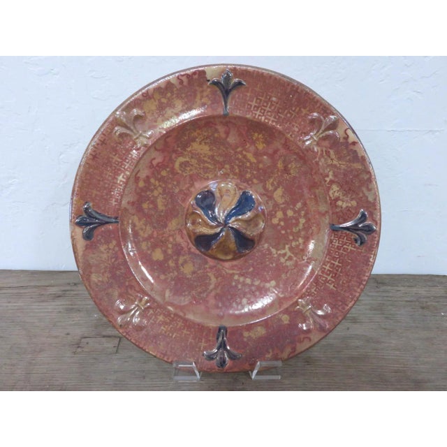 Found in Spain while on a European buying trip. This lovely plate has a rust colored background with ochre colored...