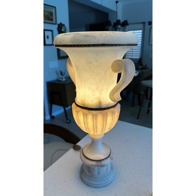 Single large vintage Italian Neoclassical style alabaster and brass urn table lamp, featuring carved handles and a fluted...