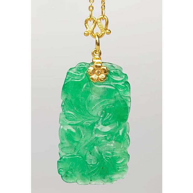 A 24k Gold Necklace with Green Carved Glass Pendant. 24k Gold Weight:0.15 Oz This simply stunning piece makes a huge...