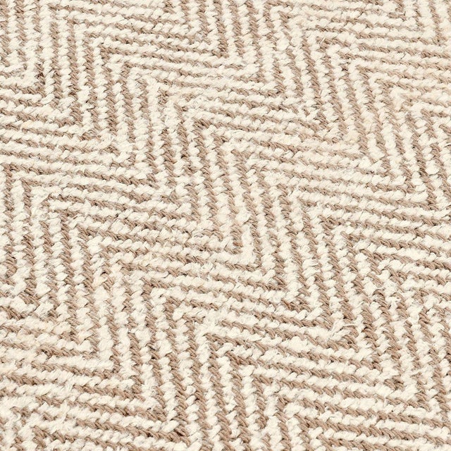 Jute and wool blended rug in airy soothing ivory and natural tones. Rhythmic subtle chevron herringbone pattern. Please...