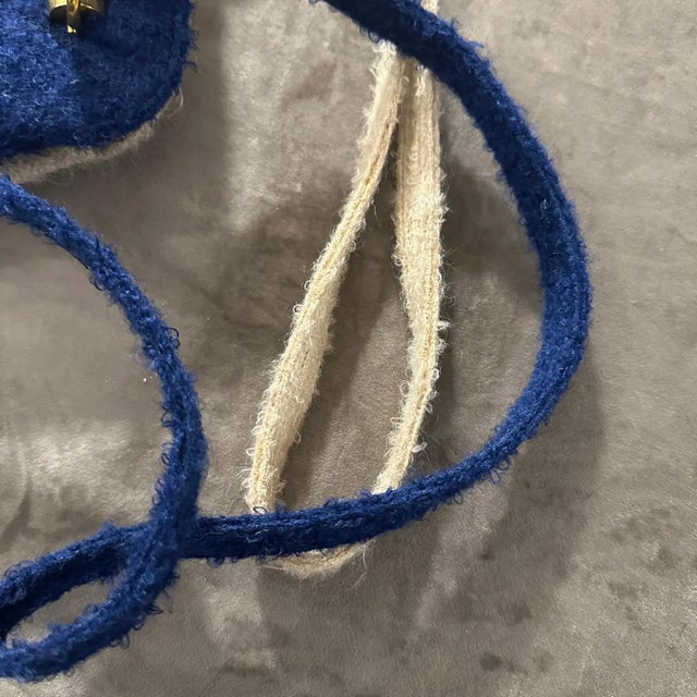 This unique 1970s vintage Italian shoulder bag combines classic craftsmanship with a distinct double-face design....