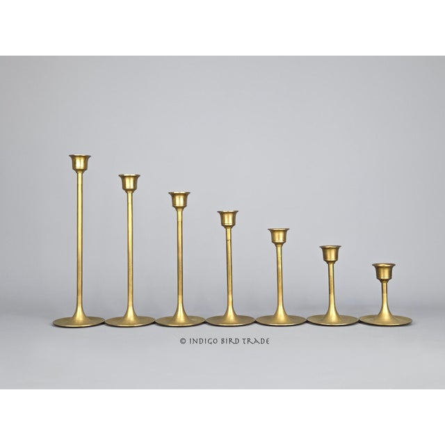 Set of 7 Vintage Solid Brass Candlesticks Tulip Style These classic graduated tulip candlesticks are made from solid brass...