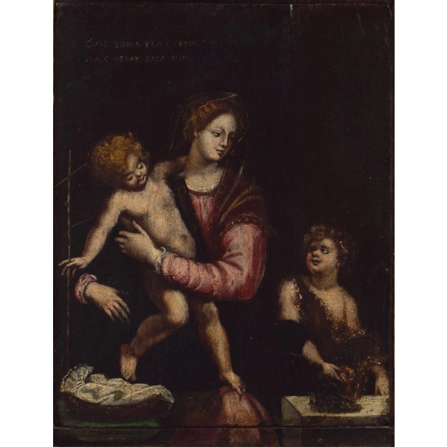 A late 17th century, devotional oil showing the Virgin Mary with Jesus and St. John the Baptist. Displayed in a fine and...