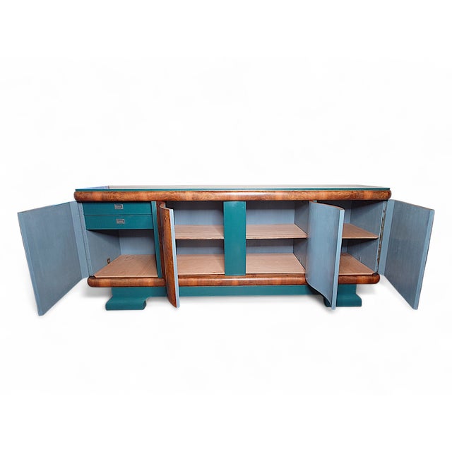 This exceptional late Art Deco sideboard was created between 1938 and 1945 and was meticulously restored by Sinteins in...