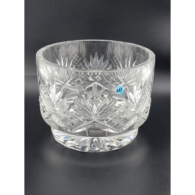 This is a vintage footed bowl made of 24% full lead crystal in Germany during the late 20th century. The bowl features an...