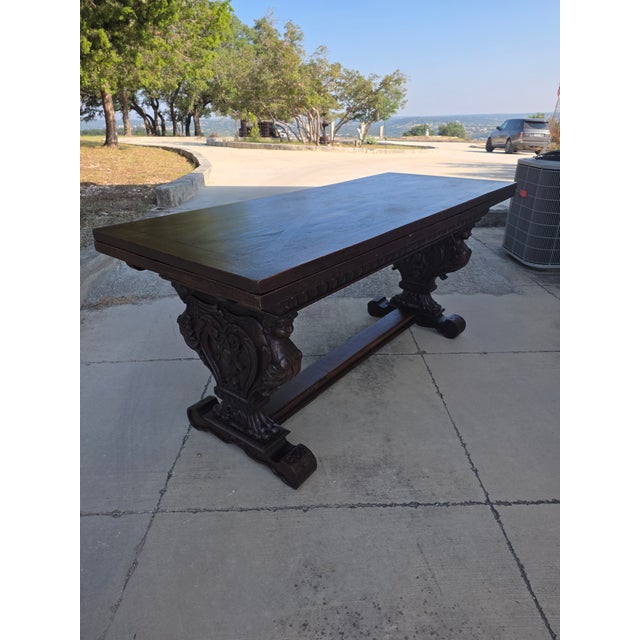 Beautiful rustic Italian draw leaf table with ornate carved base structure. This makes a wonderful work table, desk or...