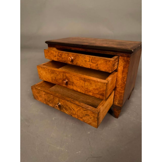 Exceptional miniature French Directoire-style apprentice chest of drawers, dating to circa 1837. This finely crafted...