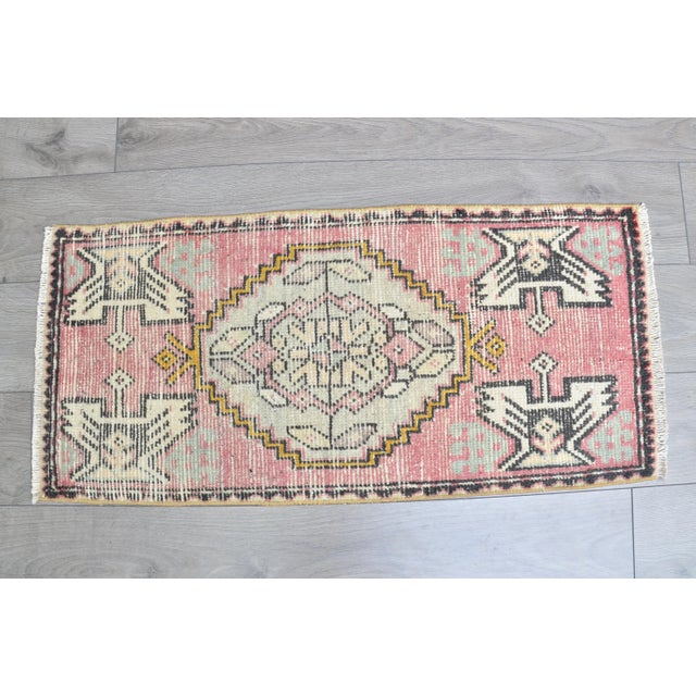 This is a vintage Turkish Oushak rug from the 1960s. The piece was hand-knotted.