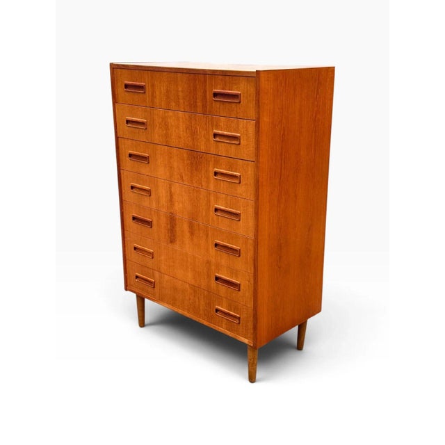 Here is a mid-century Danish modern teak tallboy dresser, also known as a chest of drawers. It is clean-lined and compact,...