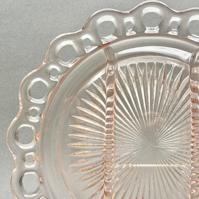 This elegant 1930s divided relish dish features the intricate lace-edge "Old Colony" pattern in a soft pink depression...