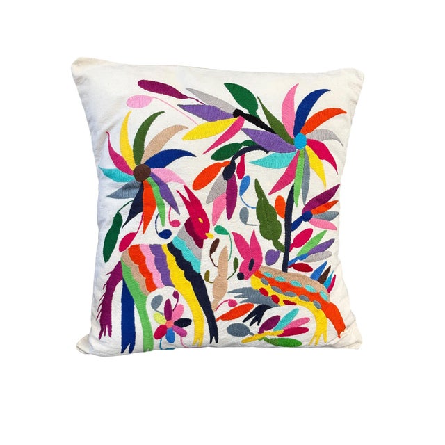 An exceptional example of Mexican Otomi embroidery textile pillow features meticulously hand-stitched imagery of two deer...