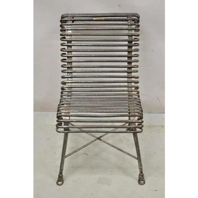 Antique French Wrought Cast Iron Spine Sauveur Arras Scrolling Garden Side Chair. Item features a wrought and cast iron...