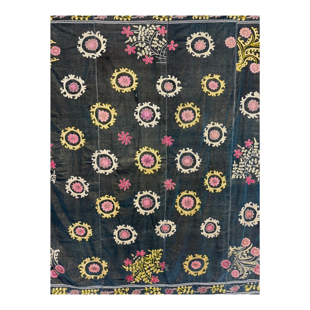 Gorgeous deep blue background with pink and gold suzani flower pattern. Very good condition. A few areas around the edges...