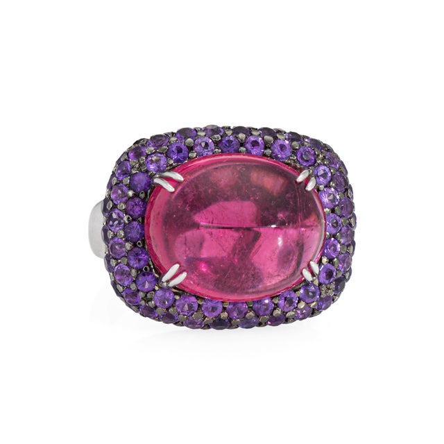 Stylish contemporary rubellite and purple sapphire ring crafted in 18 karat white gold (circa 2000s). Rubellite cabochon...