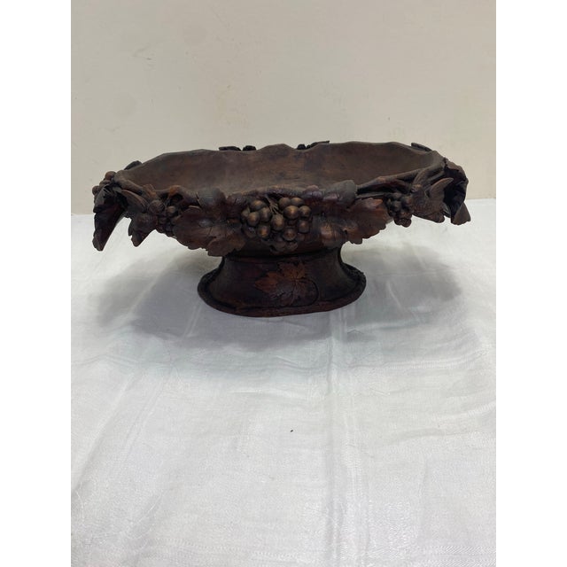A lovely high quality 19th century Black Forest centerpiece featuring extensive carving depicting fruit, leaves and birds,...