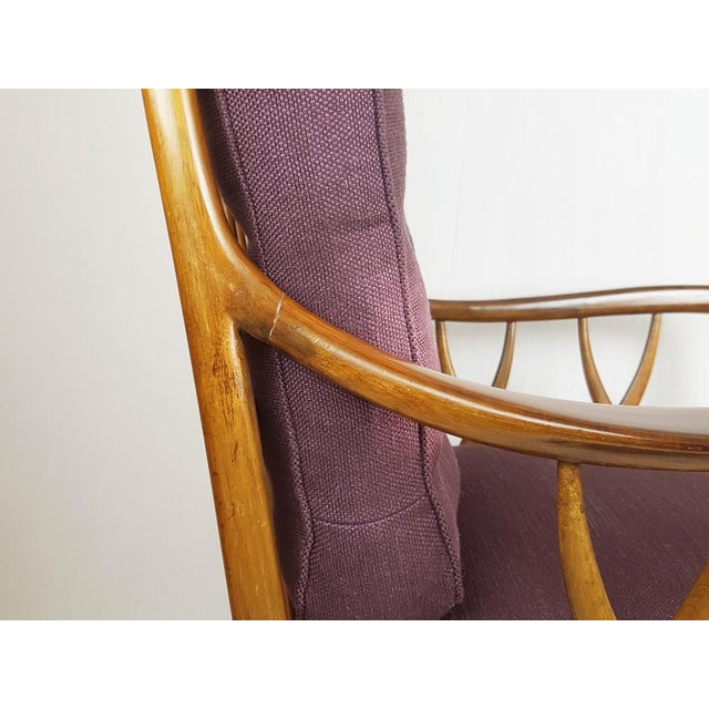 Wonderful armchair in wooden structure with purple fabric upholstered cushions. Due to its style and high quality the...