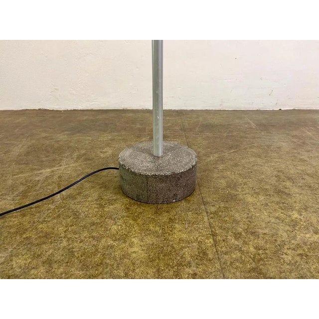 A beautiful floor lamp "stadium" by hannes wettstein for palucco. it is a rotating, pull -out floor lamp that is equipped...