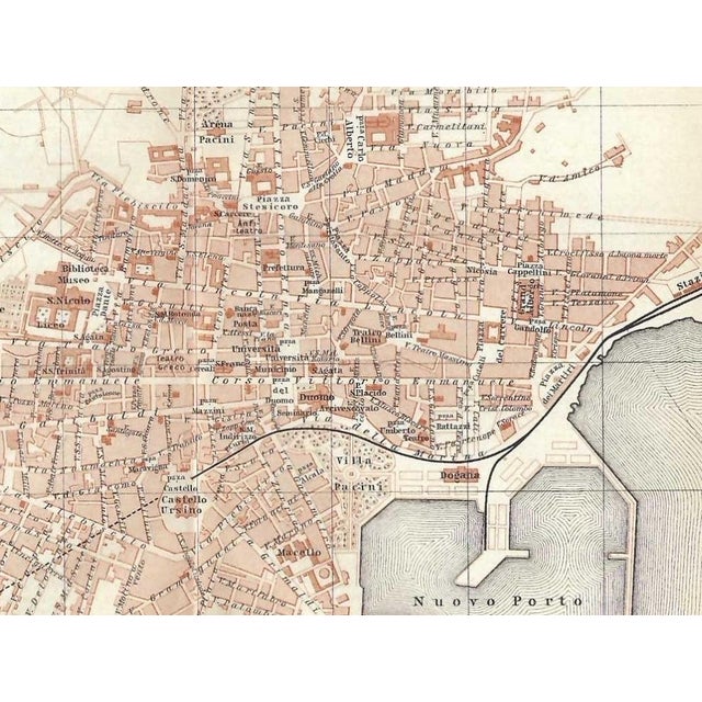 Antique map of the city of Catania on the Island of Sicily in Italy from an Italian guidebook circa 1910. Combined...