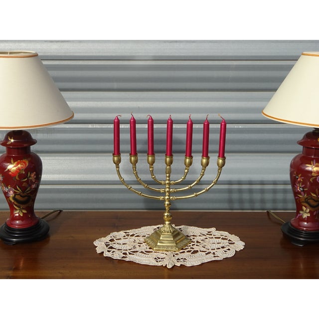 Beautiful 7-branch candelabra made entirely of gilded brass. 11 cm hexagonal base with delicate hand-crafted motifs....