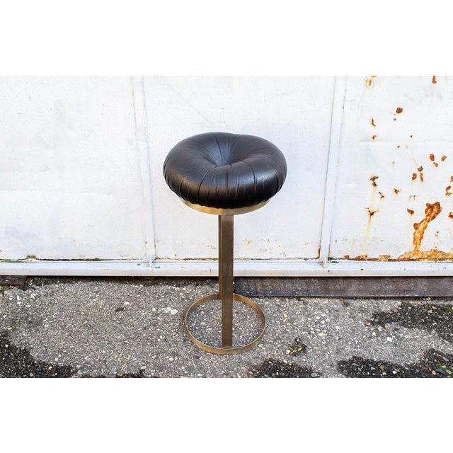 Stool with metal frame and padded seat upholstered in leather. Made in Italy 1960s