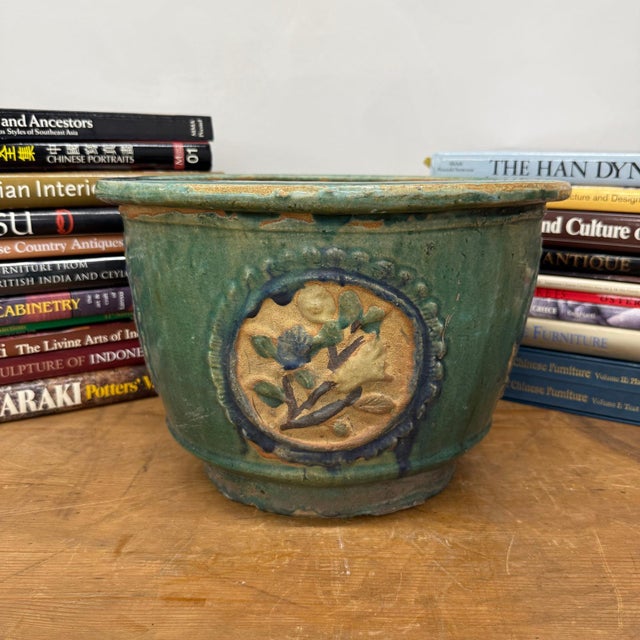 "About This Piece About This Piece Timeworn elegance meets artisan charm in this richly glazed earthenware planter. Its...