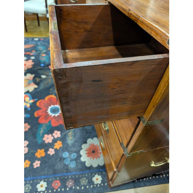 Beautiful 2 piece Victorian - British wooden campagne chest of drawers featuring rich, warm brown wood tones, distinctive...