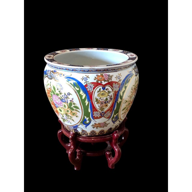 This is a beautiful porcelain fish bowl jardiniere planter that sits on a rosewood stand. Asian fish bowls were...
