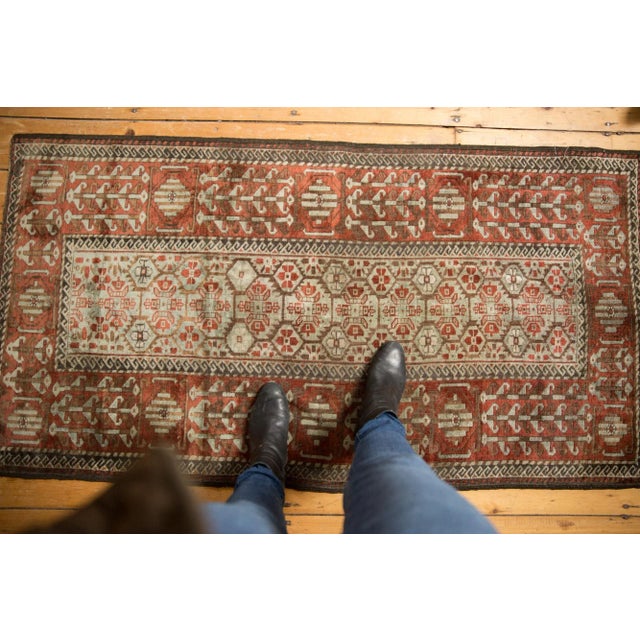 :: Narrow main field comprised of interconnecting panel floral design elements, framed with serrated vinery. Inner and...