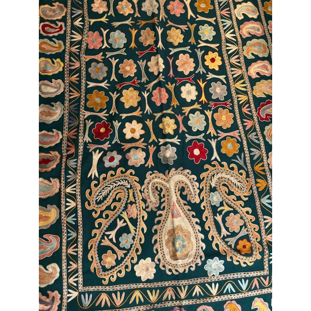 A gorgeous vintage embroidered horse blanket from Bukhara, Uzbekistan, featuring exceptionally elaborate hand embroidery...