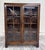 This is a beautiful vintage Georgian Revival mahogany bookcase and display cabinet featuring double astragal-style glazed...