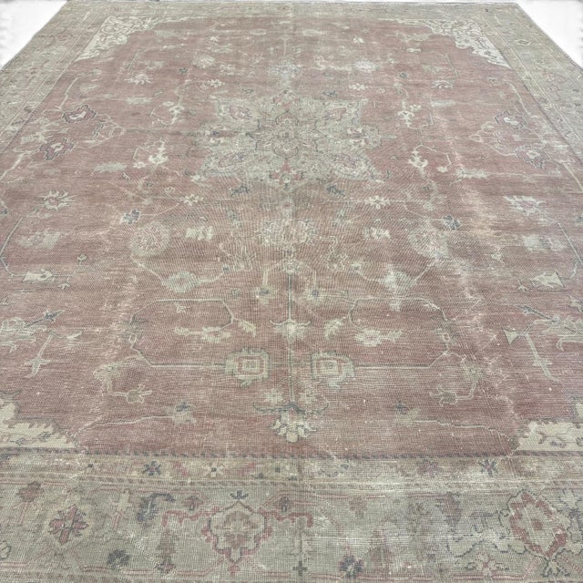 This elegant antique Turkish Gördes rug is an impressive large-scale piece with a beautifully softened palette. The muted...